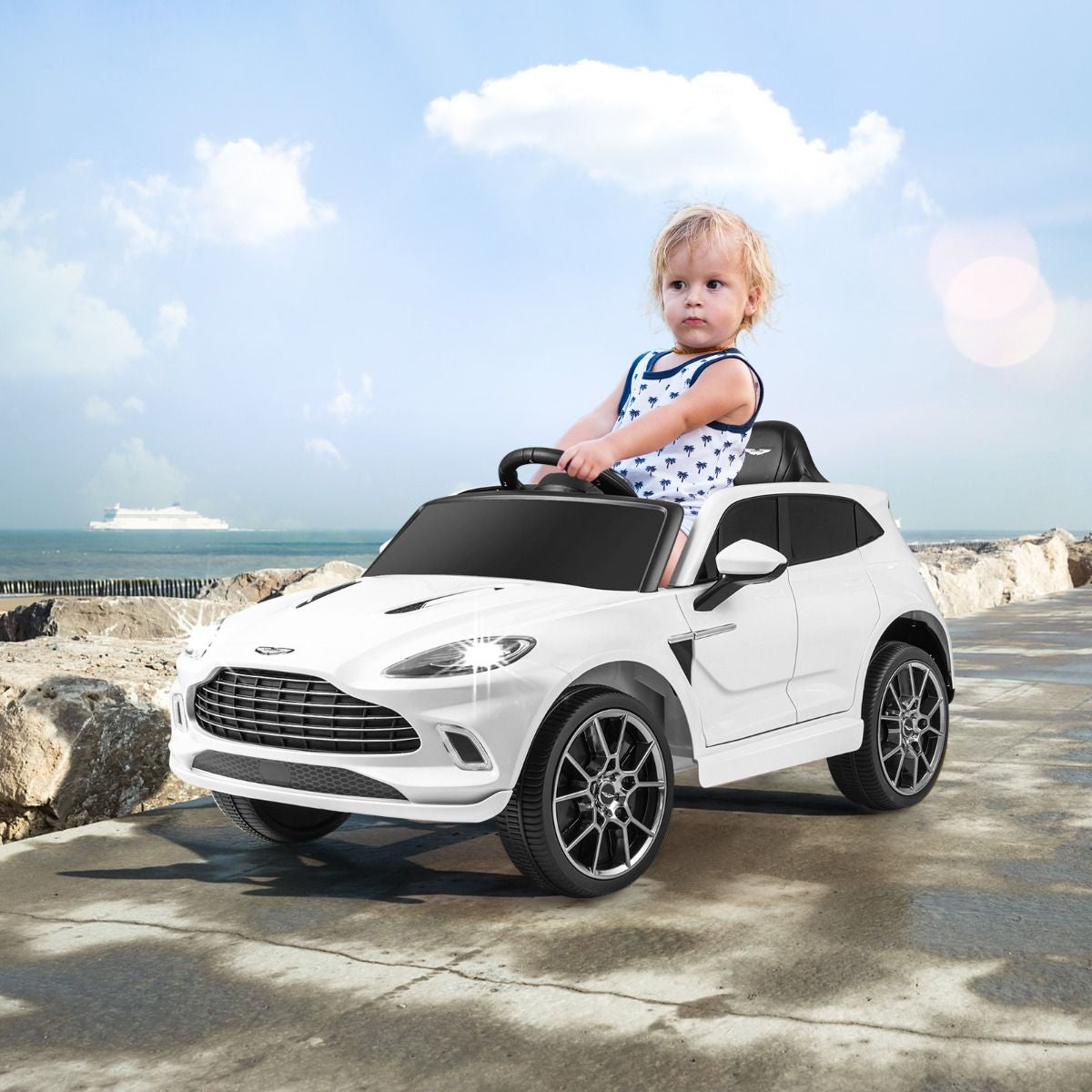 Aston Martin DBX Voiture Electrique 12V Enfants Avec Télécommande 2,4G Véhicule Moderne Avec Lumières LED Et Musique Pour 3-8 Ans Rose/Blanc