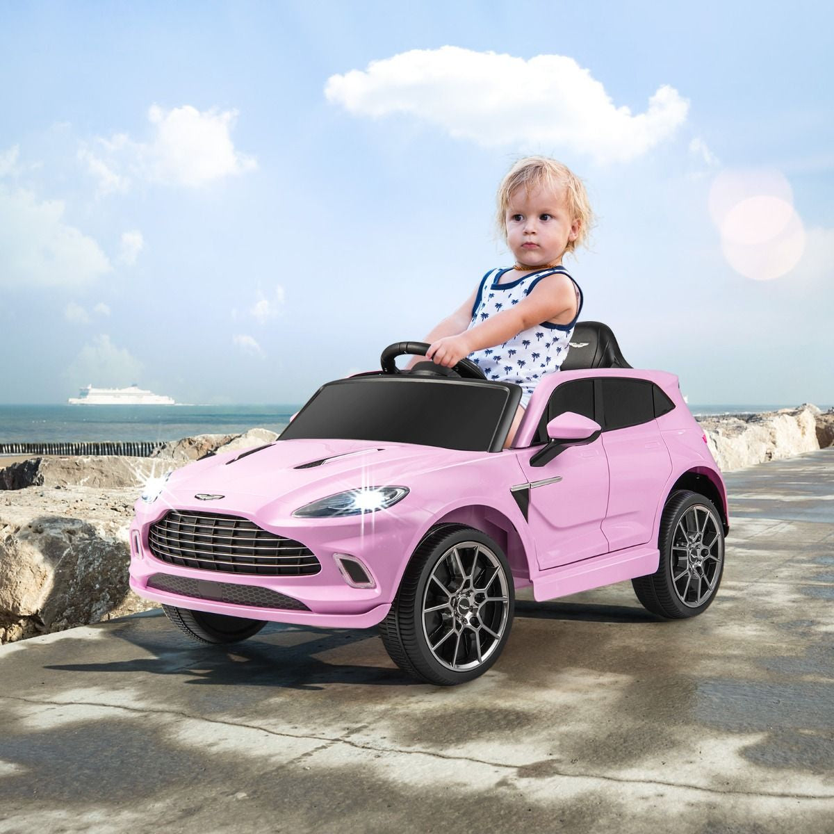Aston Martin DBX Voiture Electrique 12V Enfants Avec Télécommande 2,4G Véhicule Moderne Avec Lumières LED Et Musique Pour 3-8 Ans Rose/Blanc
